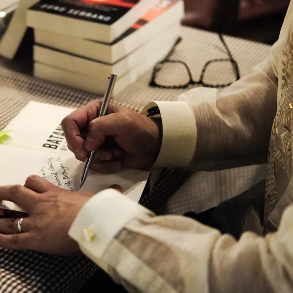 Author Bong Serrano signing copies of Batangas: My Sky and Earth at the book launch in Batangas